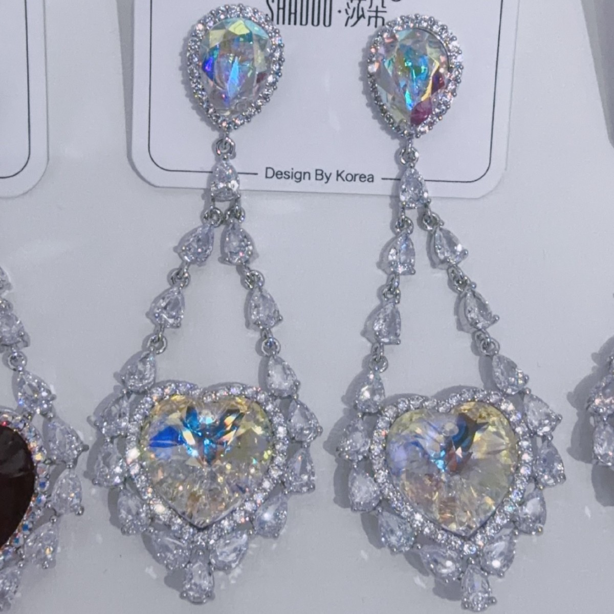 New color scheme: Fashionable and romantic heart-shaped S925 silver needle, European and American micro-inlay, light luxury, dazzling Austrian Swarovski crystal, high-end earrings, Korean Dongdaemun earrings, Ocean Heart, elegant live-streaming style details Picture