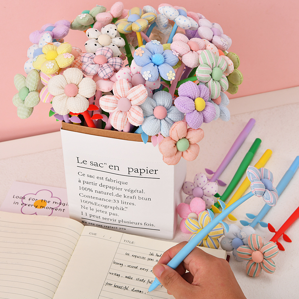 The new flower-shaped soft gel gel pen is cute and colorful with small flowers. It features a high level of appearance, a rocking pen, a signature pen and a water-based pen details Picture