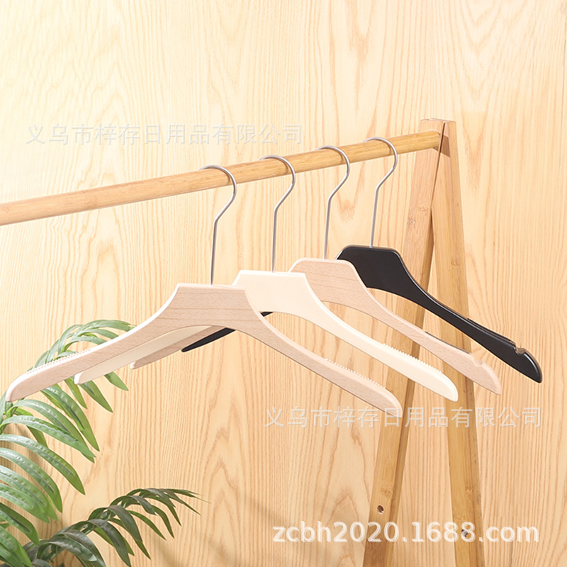 Anti-slip plastic clothes hangers, specially designed for high-end clothing stores, are available for wholesale in women's clothing stores. They are seamless and anti-slip, suitable for both men and women