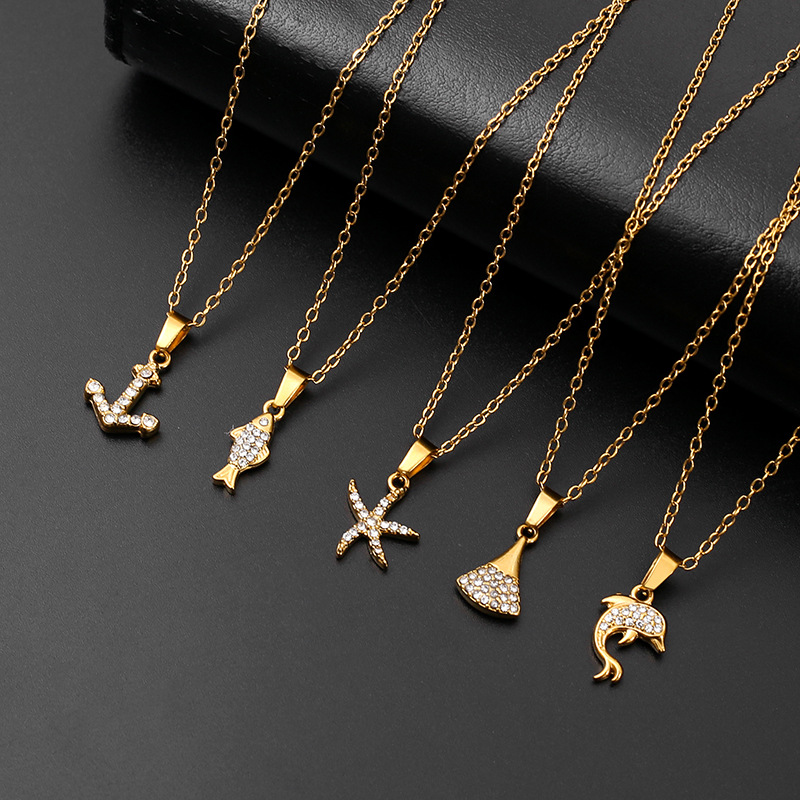 Wholesale of European and American versatile beach and ocean series diamond-encrusted small fish necklaces for women, cross-border light luxury and high-end titanium steel pendants