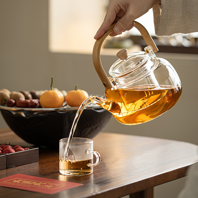 A complete set of electric ceramic stove for indoor household tea brewing, a set of flower tea sets, a glass teapot with hair Application Scenario