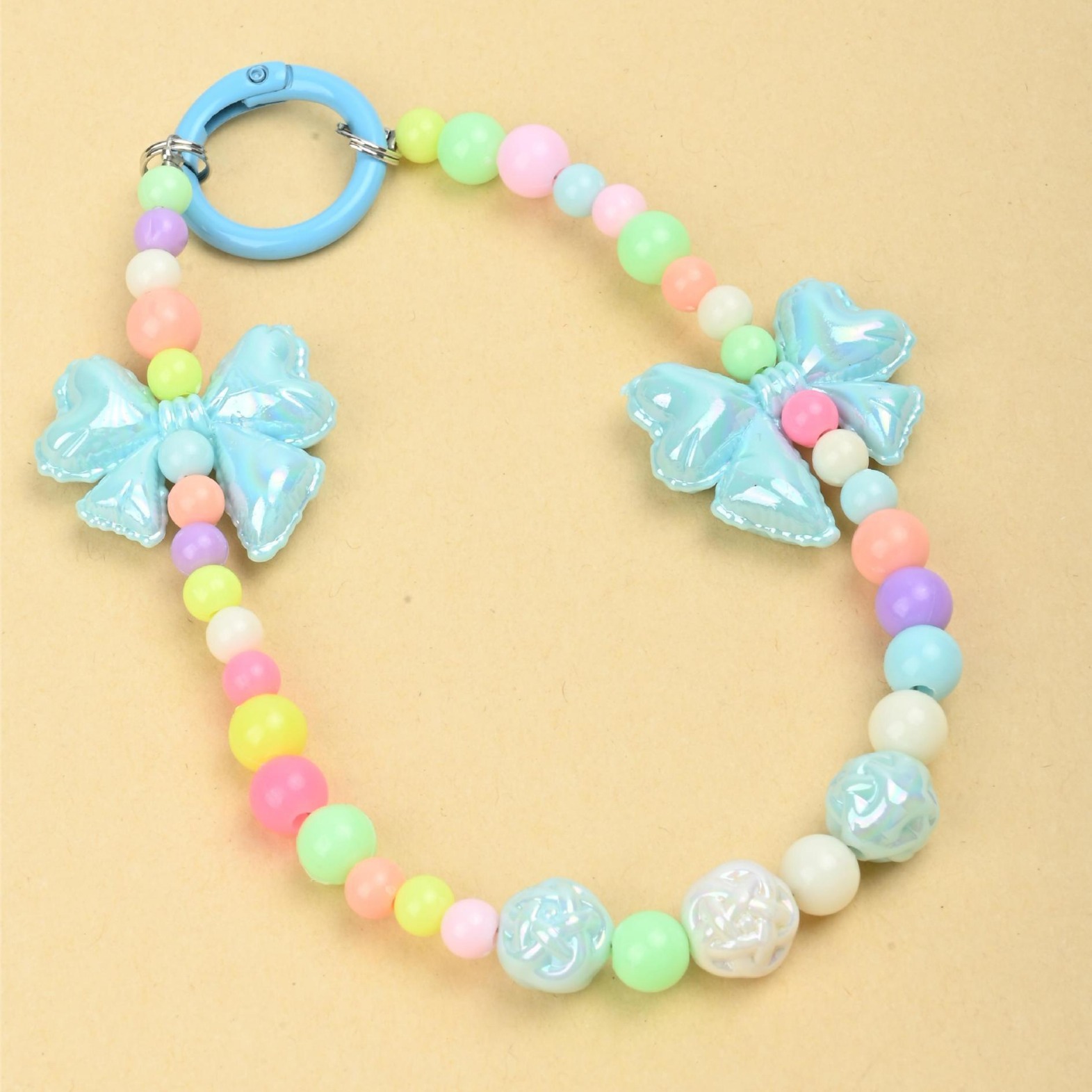 Wholesale of new colored candy-colored mobile phone chains, bows, beads, bag chains, water cup chains, car keychains and pendants details Picture