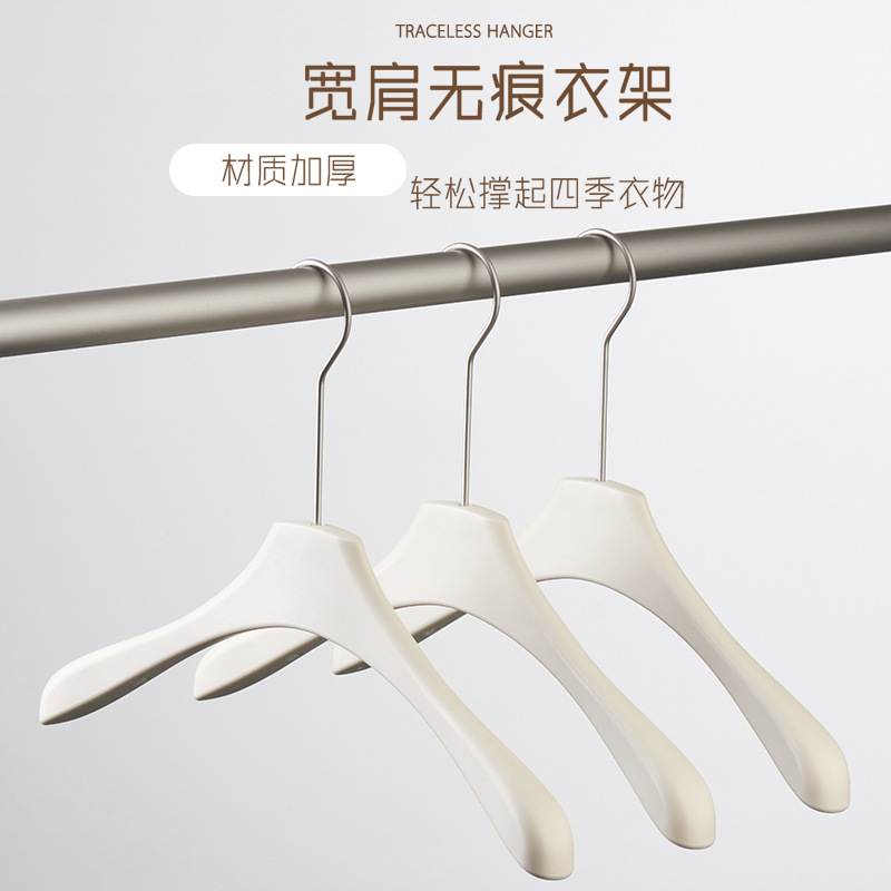 Wholesale wood-like off-white anti-slip and traceless clothes hangers for light luxury women's clothing stores