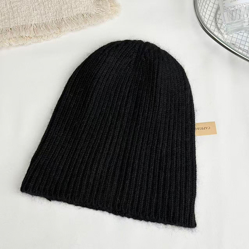 Raccoon wool European and American fashionable warm hat, knitted woolen women's ear cap, winter women's face-showing small bun, trendy solid color Application Scenario