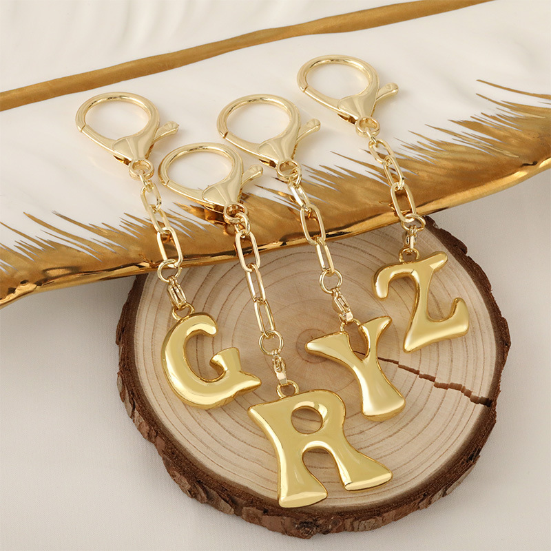 Cross-border bestseller 26-letter keychain pendant, 18K real gold electroplated, niche design, high-end charm Application Scenario