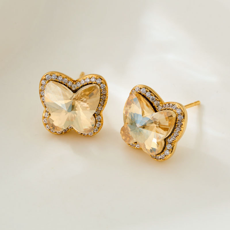 Super sparkling light luxury champagne gold butterfly stud earrings with a high-end feel, slightly studded with zirconium, factory direct supply, wholesale of best-selling earrings in stock Application Scenario