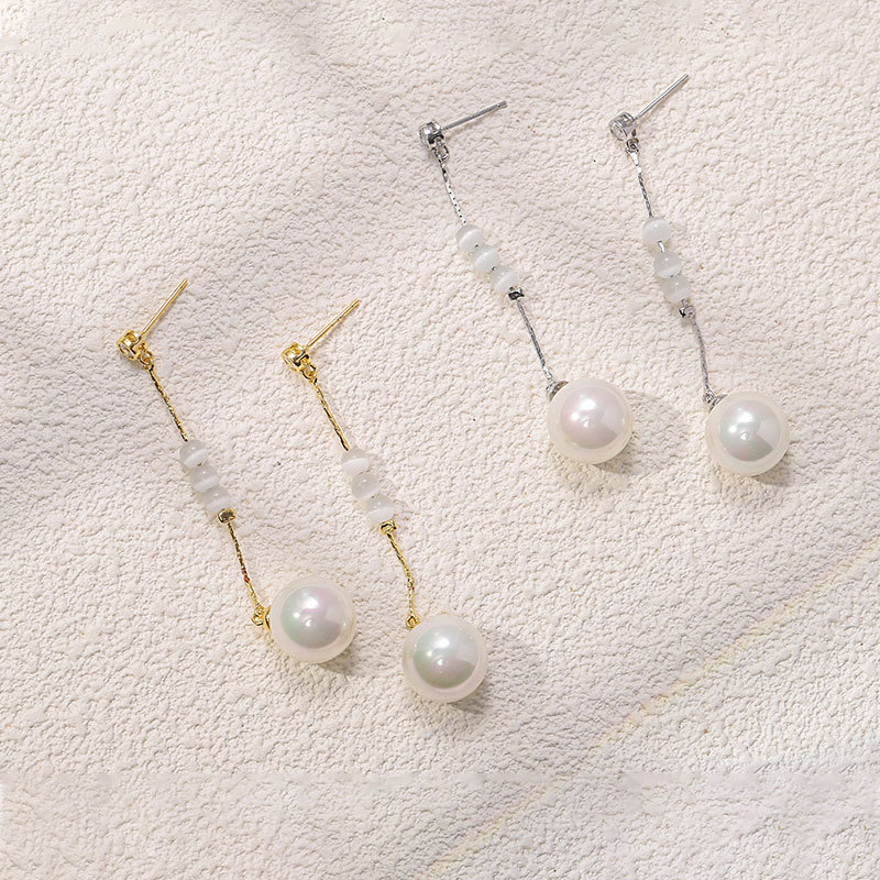 Gentle and refined tassel pearl earrings, women's Instagram niche design sense cat's eye stone earrings, high-quality earrings wholesale full figure