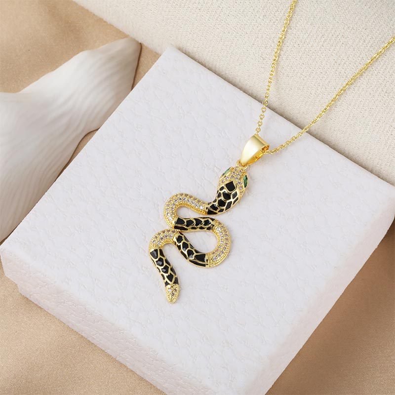 Wholesale and direct sales of new and popular micro-inlaid zircon oil-drip zodiac snake-shaped pendant accessories with cross-border personalized electroplated design details Picture