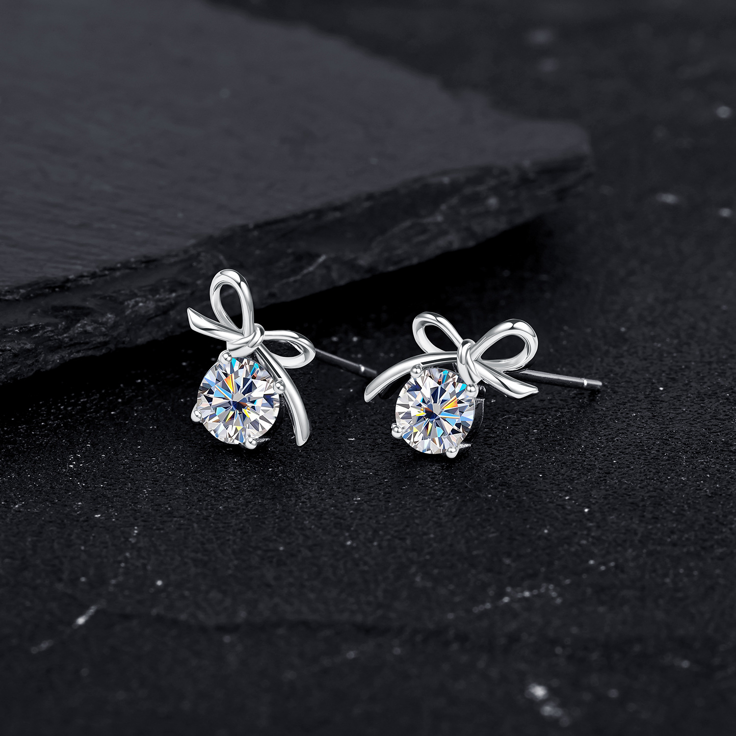 Zhuoheng selects cute and sweet bow four-prong Moissang stud earrings for women, with a fresh and delicate touch and a cute and artistic touch. Wholesale