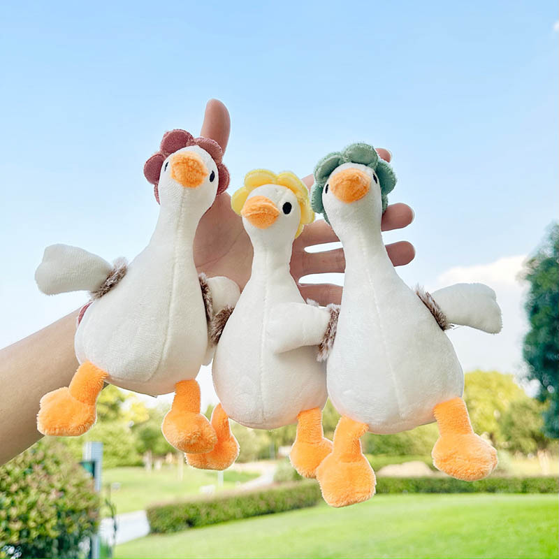 Douyin's popular big white duck plush toy keychain pendant, cute and adorable flower backpack, duck doll schoolbag hanging decoration
