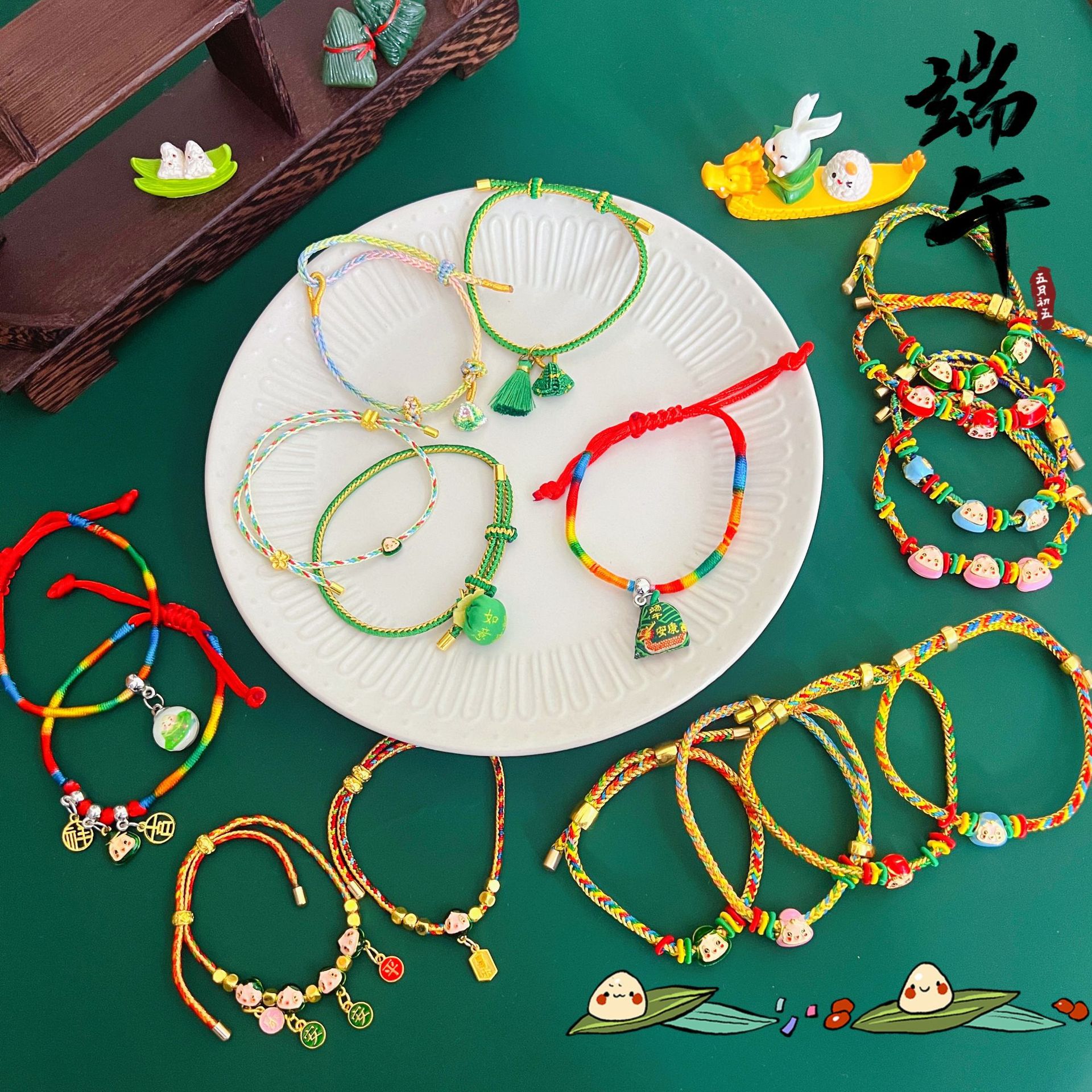 For the Dragon Boat Festival in 2025, there will be five-color rope bracelets, silver blessing zongzi, small dragon boats, and five-color thread woven bracelets for adults, children, and babies
