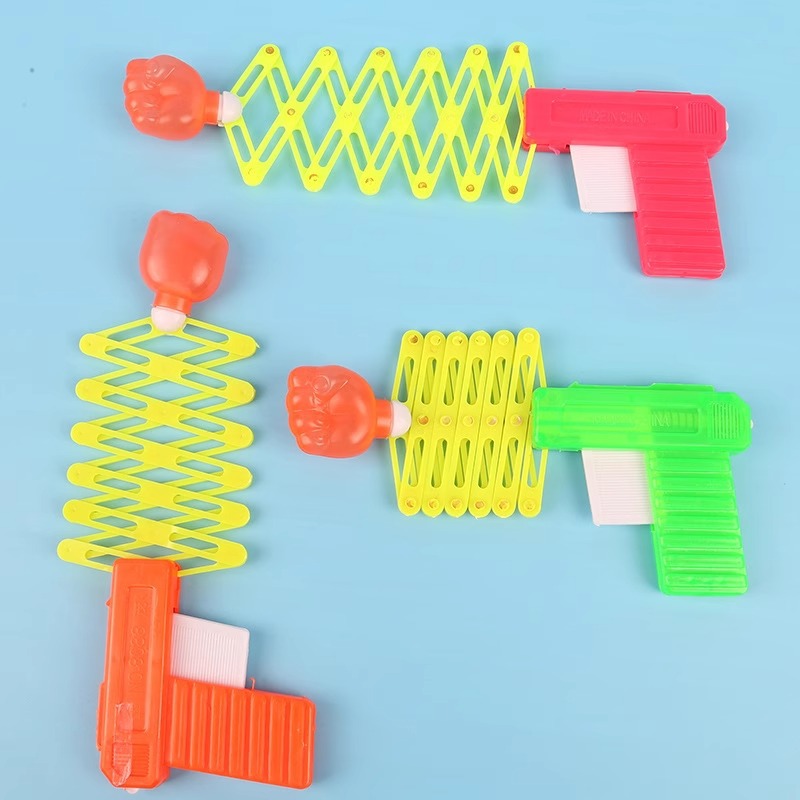 Children's funny and prank magic elastic telescopic fist gun, children's toy telescopic spring toy gun wholesale details Picture