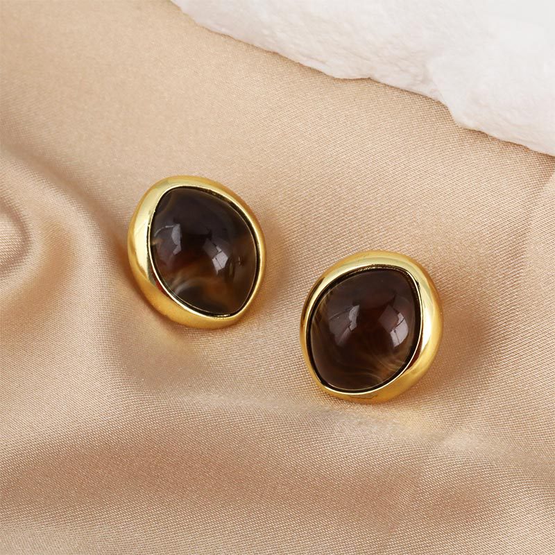 Wholesale and direct sales of cross-border copper-plated smooth resin button cat-eye round high-end light luxury stud earrings and earrings from the manufacturer
