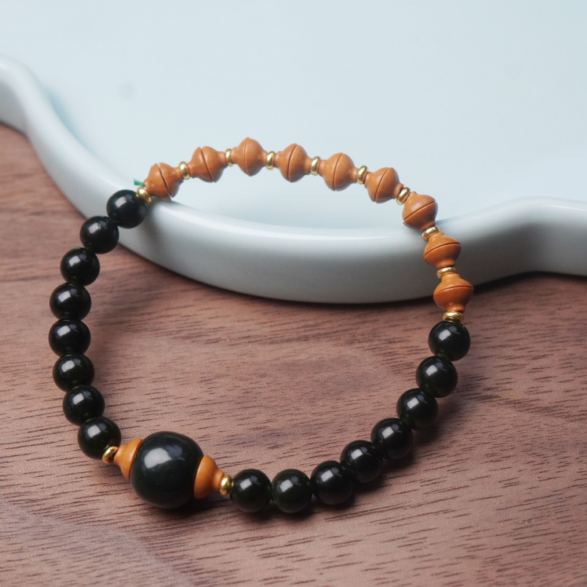 Xiangji obsidian olive kernel round bead wooden bracelet, Golden rice bowl collectible, hand-held Buddhist prayer bead bracelet, women's accessory Specification image