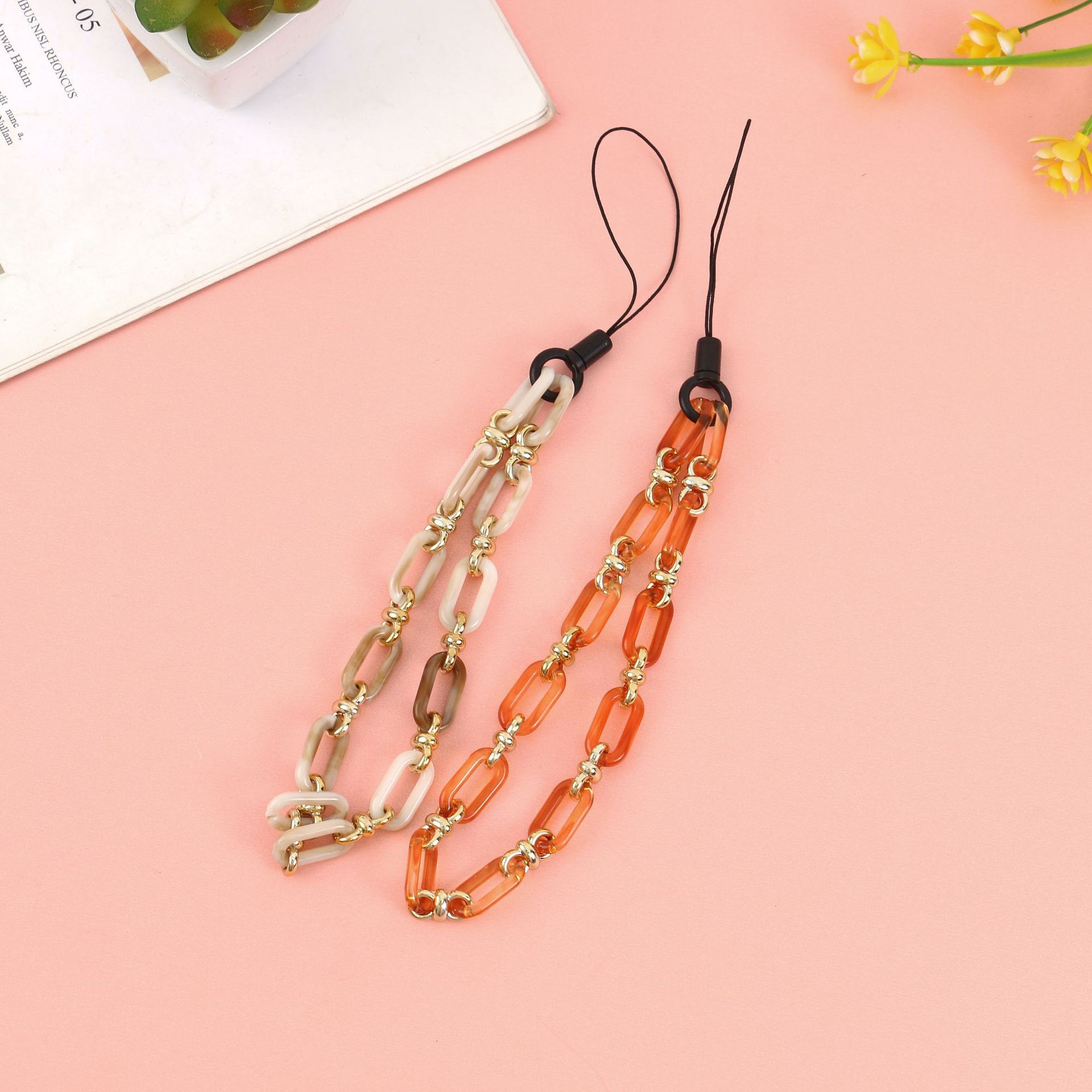 Cross-border new best-selling solid-color acrylic gold ring buckle mobile phone chain, creative mobile phone pendant, short mobile phone lanyard for women Application Scenario