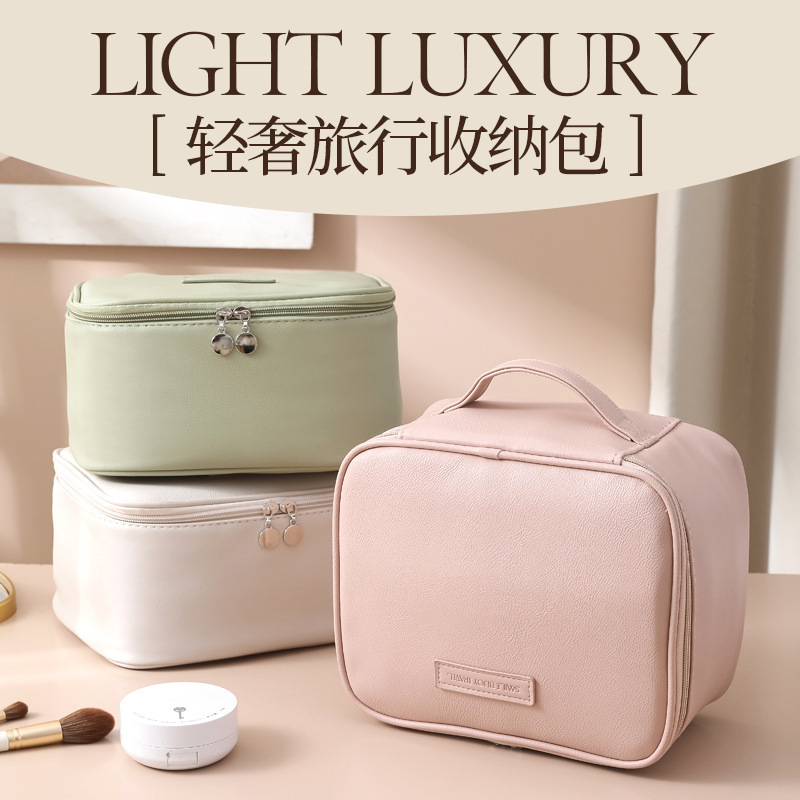 New light luxury makeup bag, portable large-capacity travel toiletry bag, multi-compartment hand-held cosmetics and makeup bag