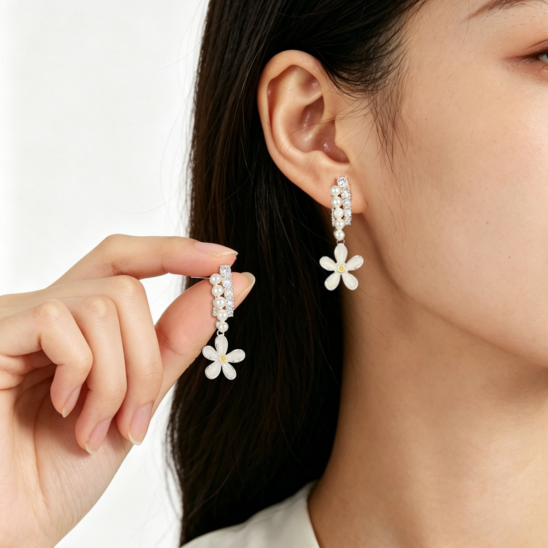 The fresh and small Daisy stud earrings feature a niche design with a light luxury and high-end feel. They are made of copper alloy with zircon s925 silver needles and are versatile earrings