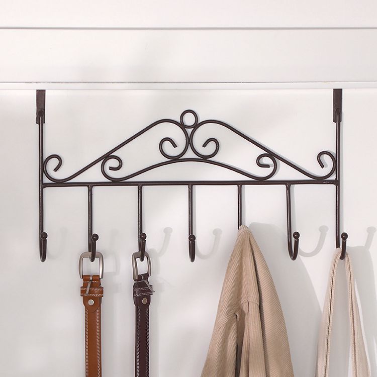 A creative rack for hanging clothes and hats without drilling holes, hooks at the back of the door, nails, clothes hangers on the door, or installation on the back of the door