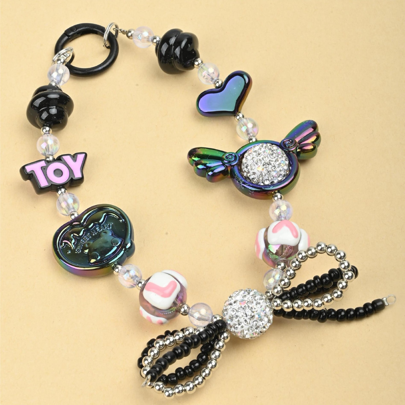 Wholesale of irregular handcrafted beaded diamond balls, double-layer bow ties, mobile phone chains, keys, bags and pendants in the Japanese and Korean ins style