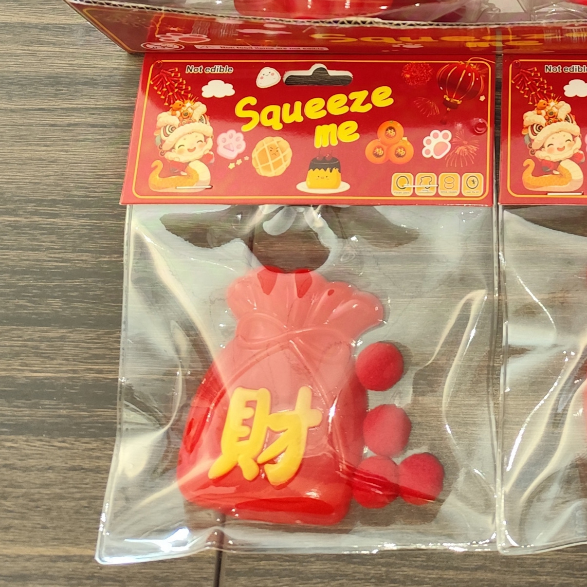 In 2025, may you have good fortune and prosperity in the New Year. Pinch Fun TPR Chinese Red Lucky Bag Cat Paw Stress-Relieving Toy Release TPR Blind Bag Application Scenario