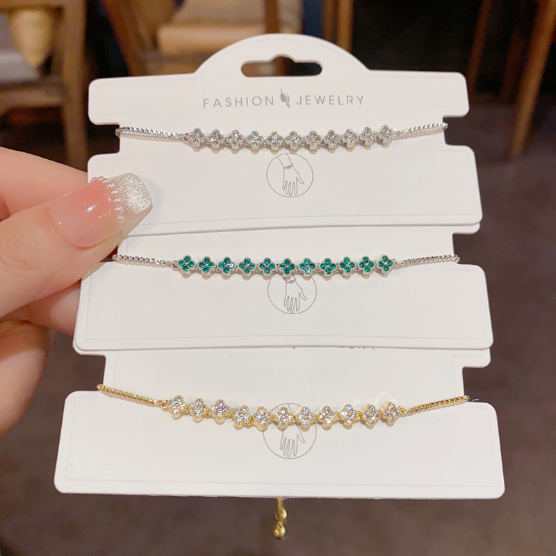 Korean version exquisite, fashionable, versatile, super shiny, full diamond four-leaf flower bracelet, niche style, light luxury and high-end jewelry wholesale