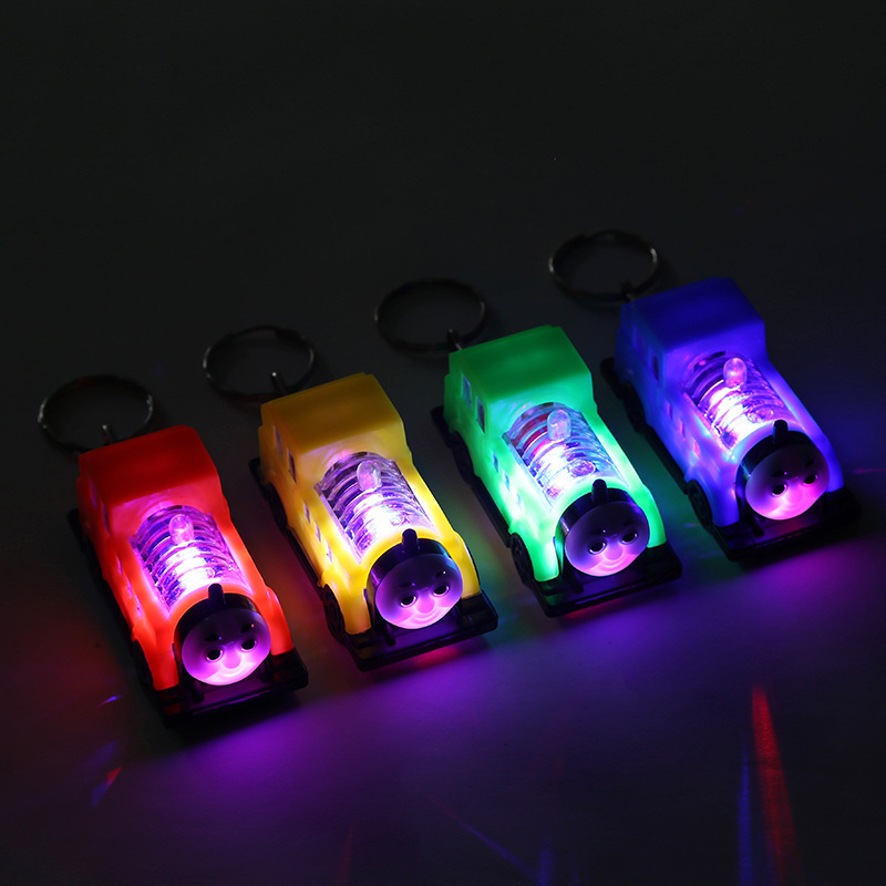 Factory wholesale cartoon toy cars, illuminated keychains, cars, mini train toys, mini children's play floor push pendants details Picture