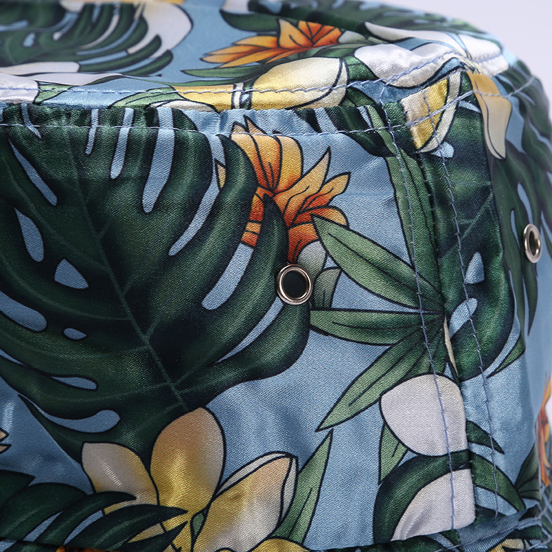 A custom-made printed floral imitation silk fisherman's hat, a fashionable outdoor outing flat-topped wide-brimmed windproof basin hat Application Scenario