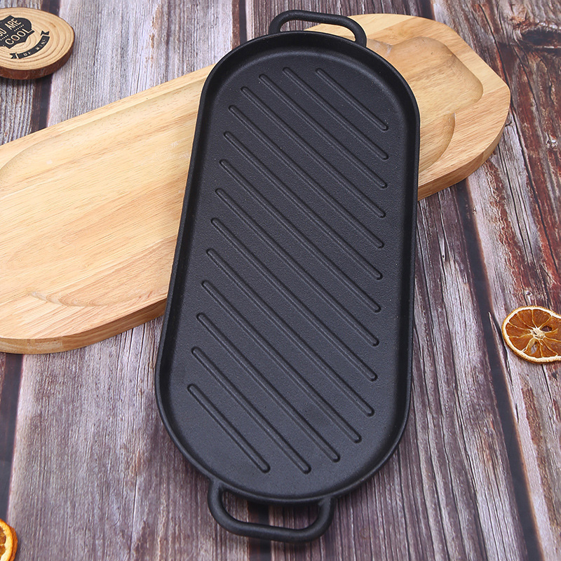 Cast iron outdoor steak teppanyaki double-ear oval induction cooker barbecue plate, household pine board fish frying and grilled meat plate details Picture