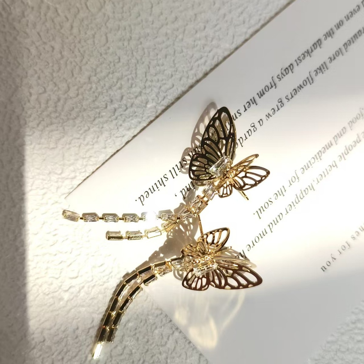 Wholesale 925 silver needle earrings, trendy and fashionable, long diamond-encrusted tassel butterfly hollowed-out earrings and earrings Application Scenario