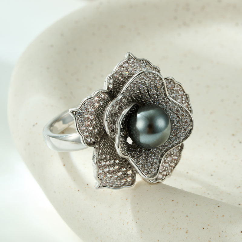 A light luxury and high-end grey pearl camellia open ring, a copper alloy slightly inlaid zircon adjustable index finger ring Application Scenario