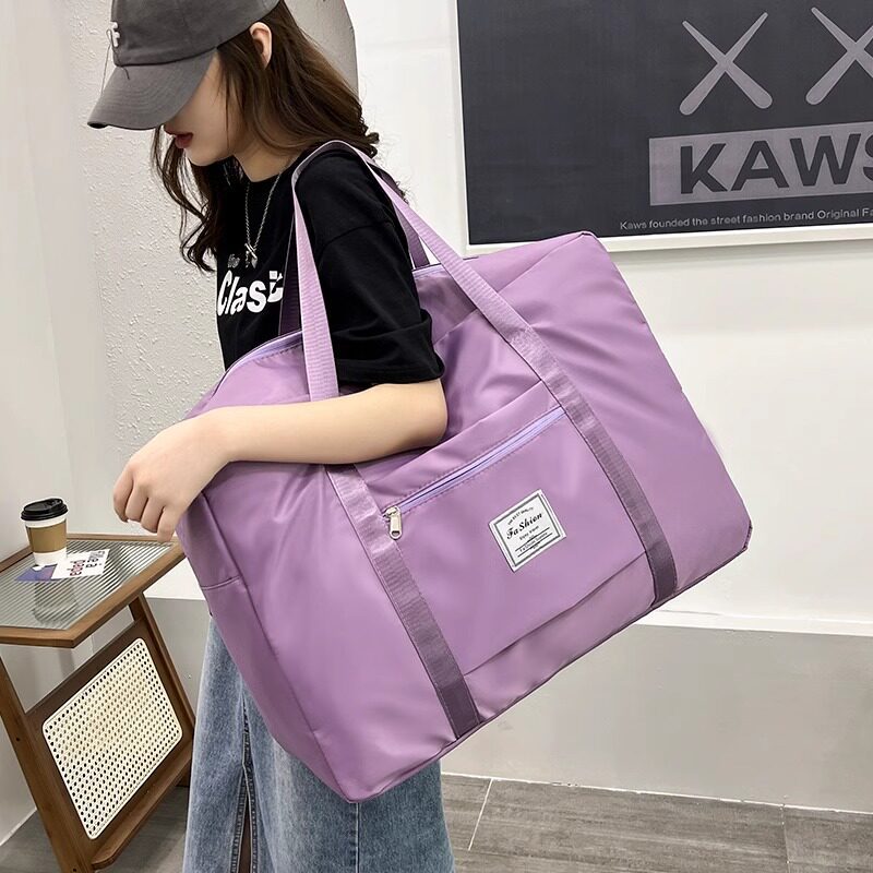 Wholesale of large capacity hand-held luggage bags, clothes and quilts, twill Oxford cloth finishing bags Application Scenario