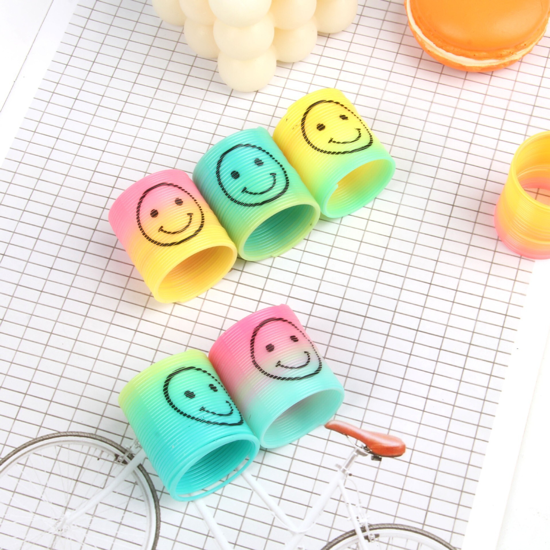 Small rainbow hoop toy wholesale street stall, educational quality gradient spring hoop play magic hula hoop cross-border Application Scenario