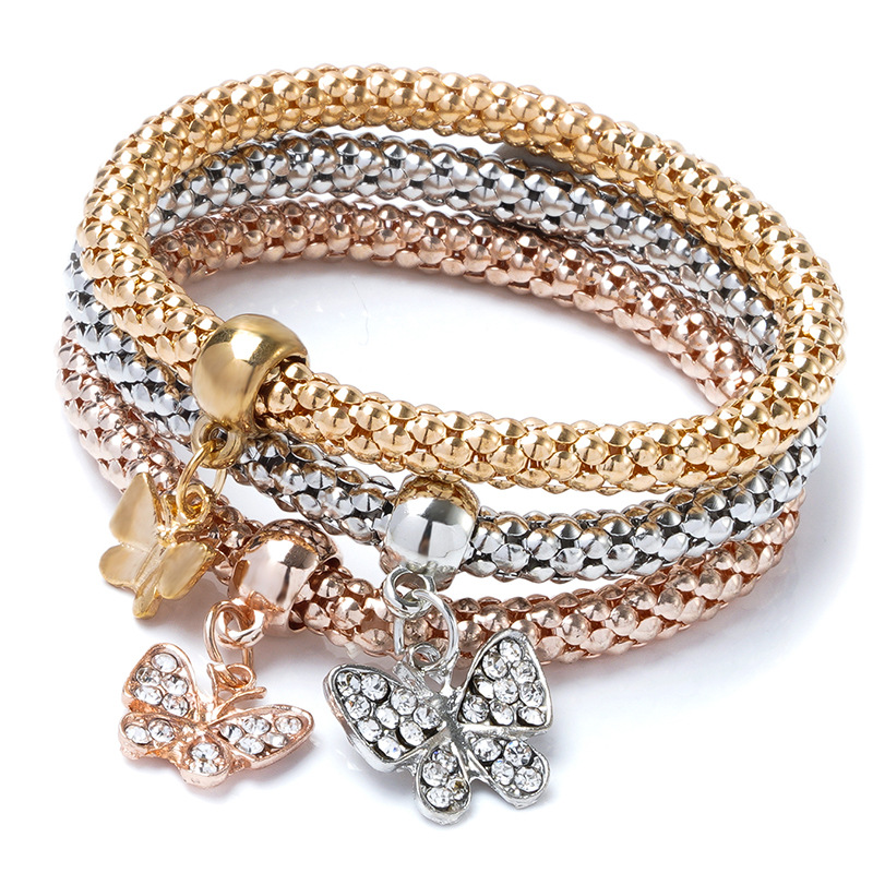 A cross-border best-selling alloy three-color set of elastic popcorn corn chain with diamond heart pendant bracelet for women from Europe and America Item Picture