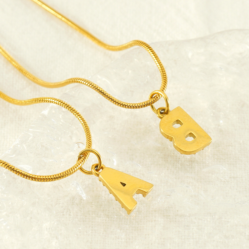 Cross-border European and American stainless steel fashion 26 English diamond-encrusted small letter necklace, simple and versatile titanium steel snake chain necklace for women Application Scenario