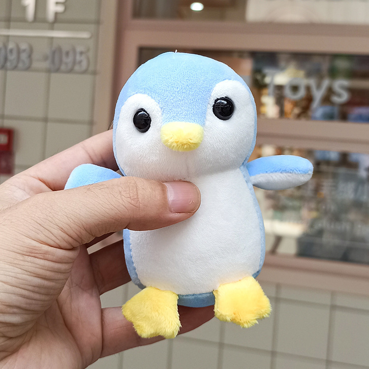 Wholesale of creative cartoon four-sided bouncing penguin plush pendants, cute animal dolls, bags, car keychains and pendants details Picture