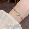 This summer, fresh, fashionable, sweet and versatile hollowed-out heart-shaped pull-out bracelet is a light luxury, simple and high-end accessory Application Scenario