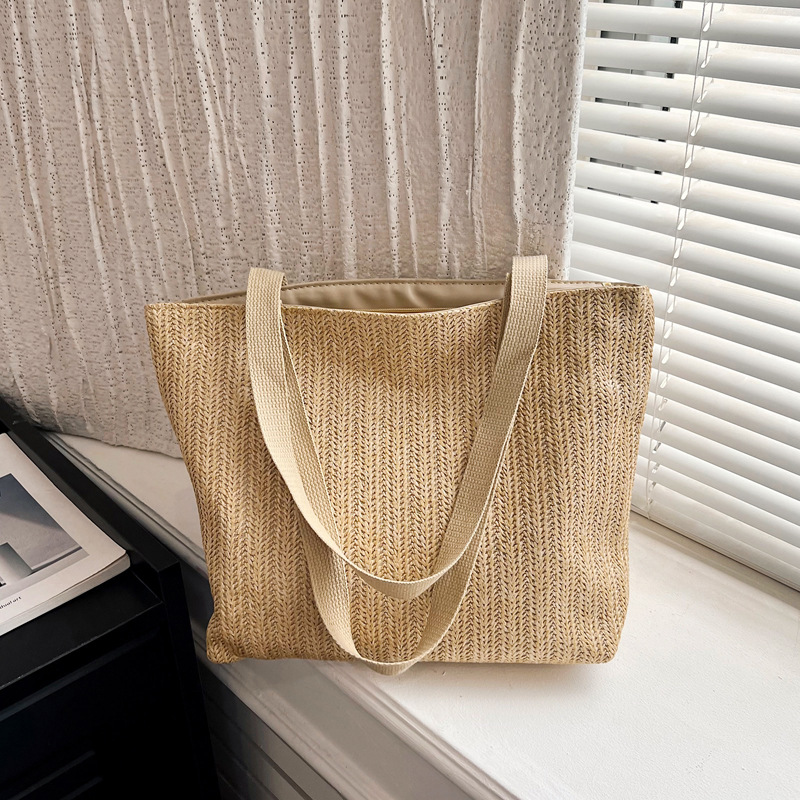 Bolsa de paja transfronteriza de color sólido simple de gran capacidad bolsa de mujer de paja de un hombro ligero para el trabajo diario bolsa de tejido de vacaciones junto al mar bolsa de playa bolsa de paja artesanal