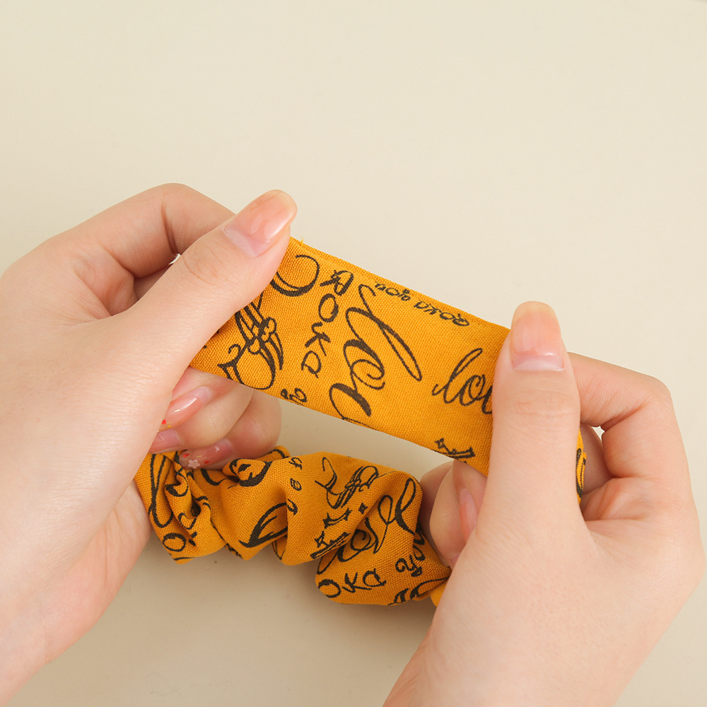 Korean imported high-end letter-shaped large intestine hair band, fashionable hair tie, ponytail bun hair accessory hair band Application Scenario