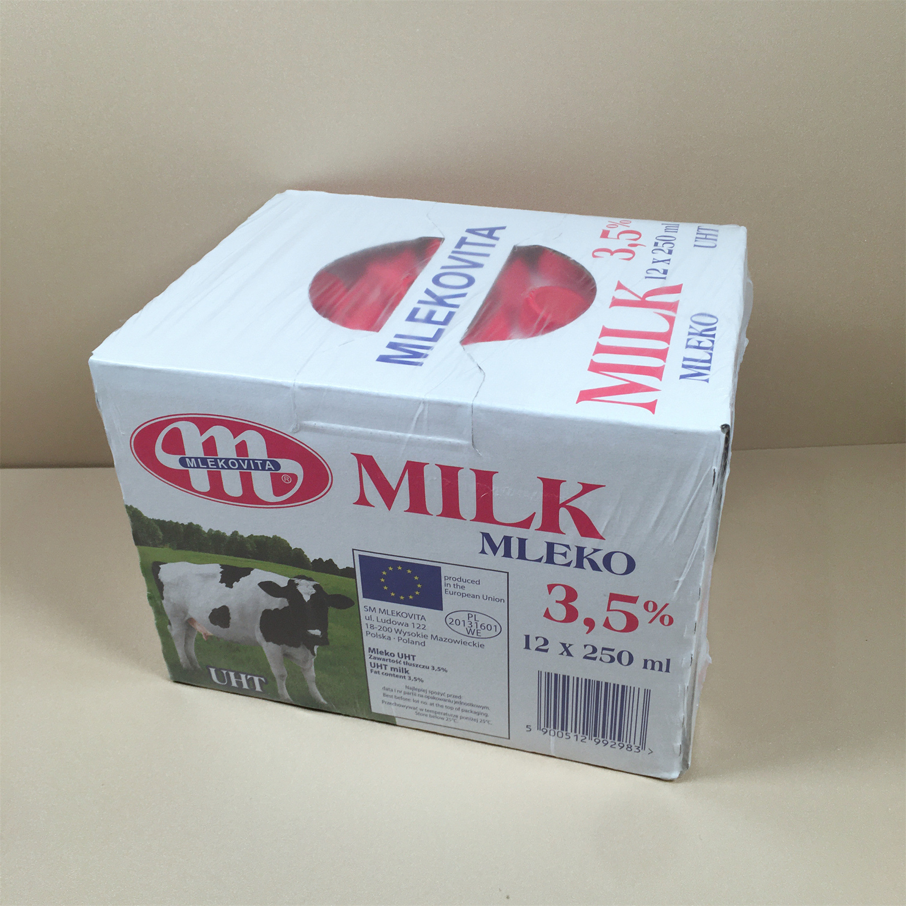 A whole box of 12 bottles of 250ML Mlekovita full-fat sterilized pure milk from Poland