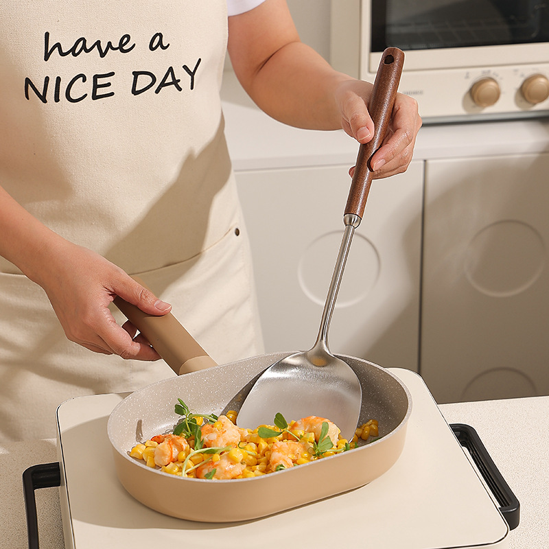 Stainless steel kitchenware set with a strainer, soup spoon, spatula, wooden handle, smooth soup shell and soup drain details Picture