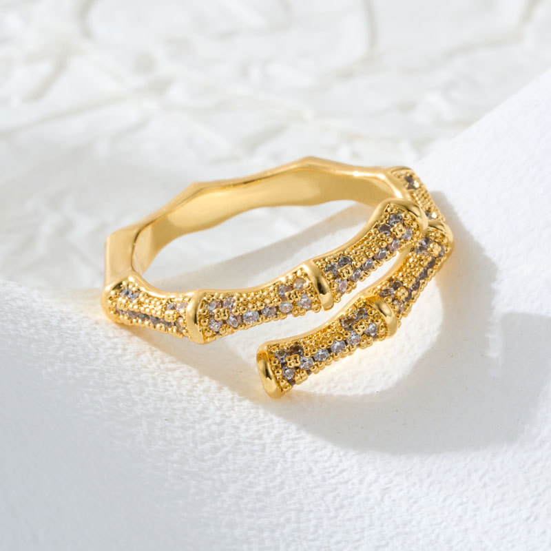 A light luxury double-layer overlapping bamboo-joint open ring with a high-end feel. It is made of copper alloy, set with zircon, and electroplated with real gold for adjustment Application Scenario