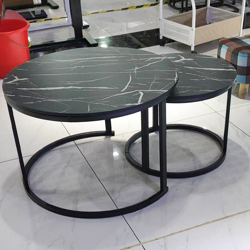 A light luxury minimalist coffee table with a round table for small-sized apartments. A creative rock plate round coffee table set for the living room Application Scenario
