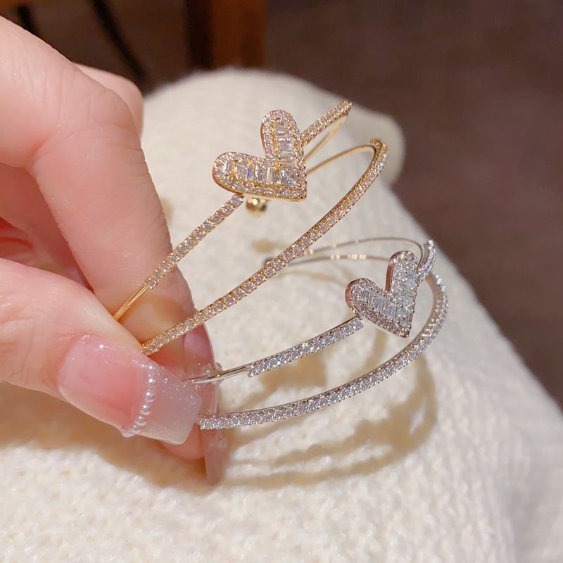 This exquisite, fashionable and light luxury zircon heart-shaped double-layer open bracelet from Japan and South Korea is unique, versatile, and exudes a high-end and dazzling charm. It's a perfect accessory for women
