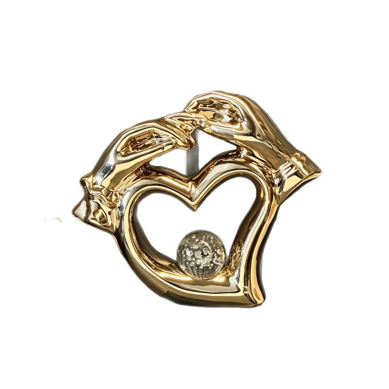 A light luxury heart-shaped ceramic decorative piece with a hollowed-out heart shape and a hand-held crystal ball, a romantic decoration technique for the wedding room and living room Item Picture