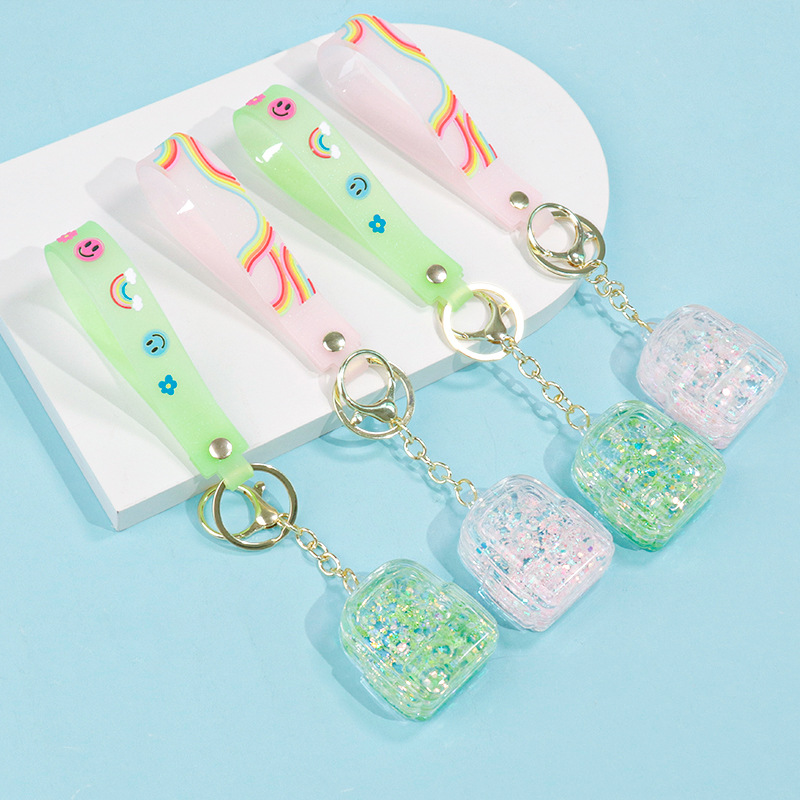 Creative oil-in-oil flowing sand schoolbags, keychains, pendants, couple fashion bags, key chains, exquisite and cute gifts wholesale details Picture