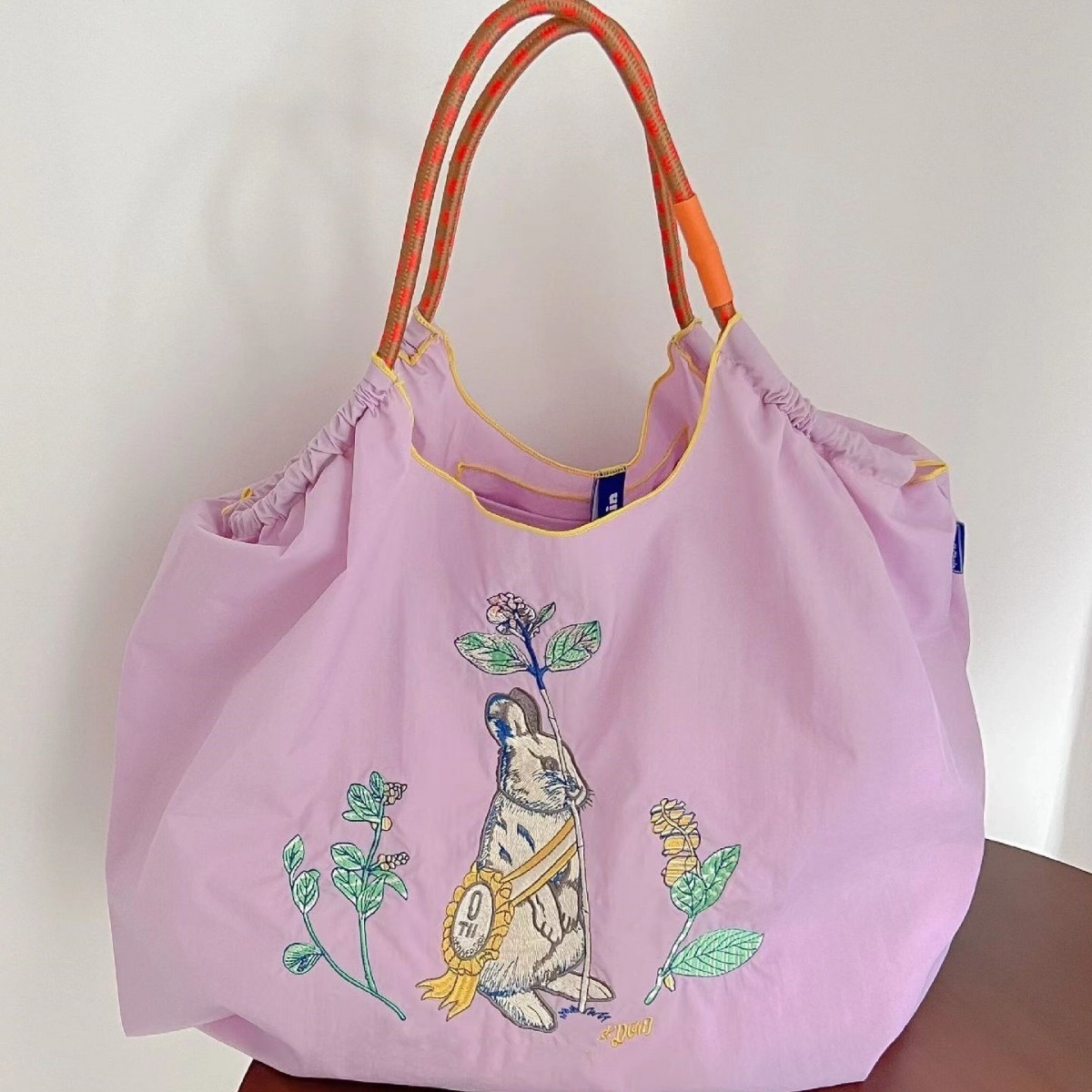 The same style of popular tote bag for the Year of the Rabbit, embroidered shopping bag, hand-held crossbody single-shoulder bag, nylon waterproof, lightweight and large capacity Application Scenario