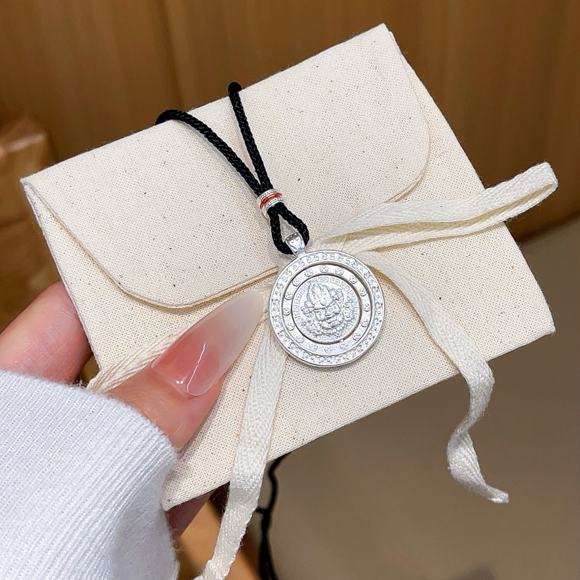 Wholesale of new Chinese-style rotatable wealth God rope necklace pendant and sweater chain accessories with copper plating, Miao silver and Tibetan silver full figure