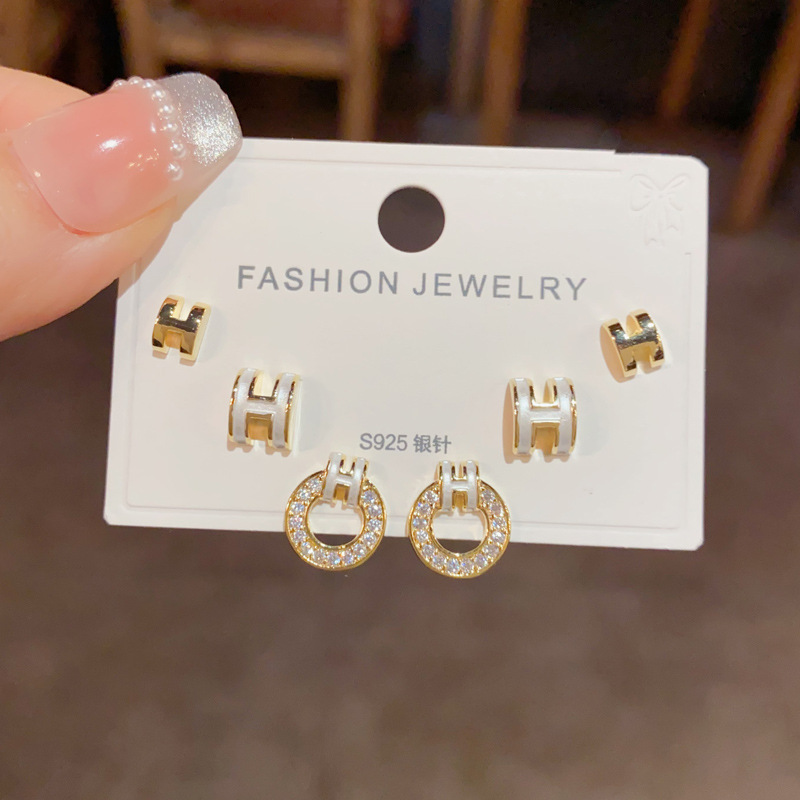 Wholesale of small and fashionable H-letter circular three-piece ear stud earrings with a feminine charm, simple and compact silver needle earrings Item Picture
