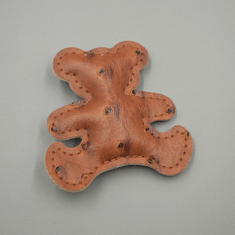 الدبّ الملون، الحلي الجلدية Specification image
