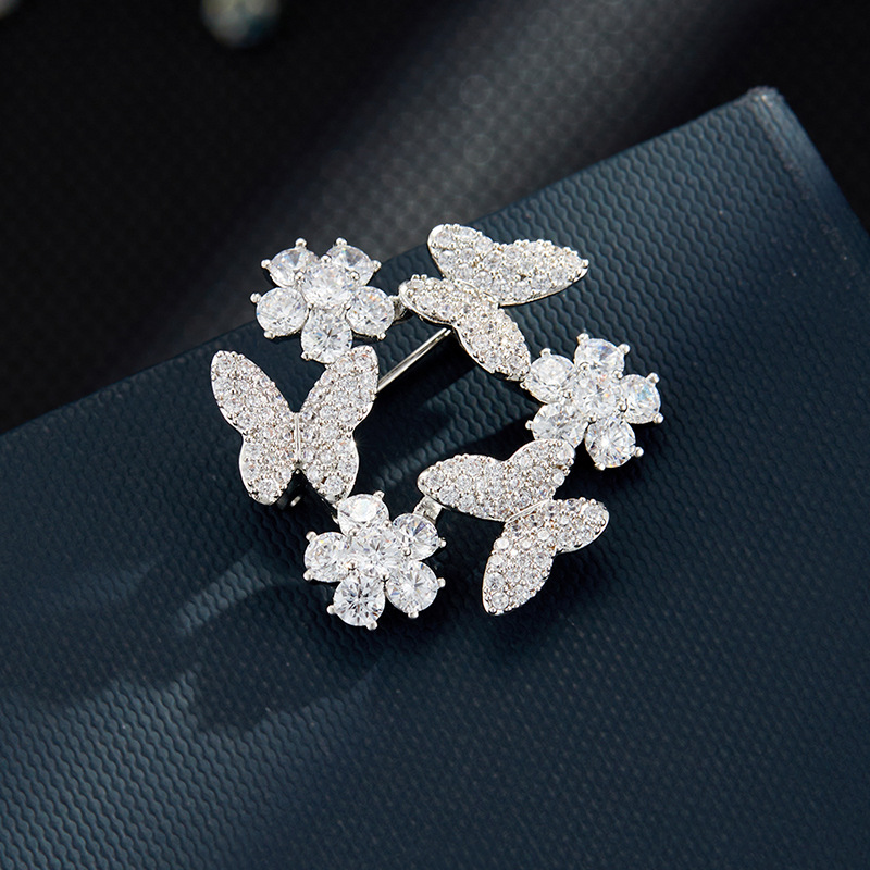 A light luxury style with a high-end butterfly wreath brooch, made of copper alloy and slightly inlaid with zirconium, is a fashionable and versatile clothing accessory and a best-selling women's pin